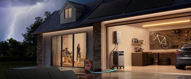 A portable power station and wall-mounted battery unit installed in a home garage during a storm, with solar panels and an electric car