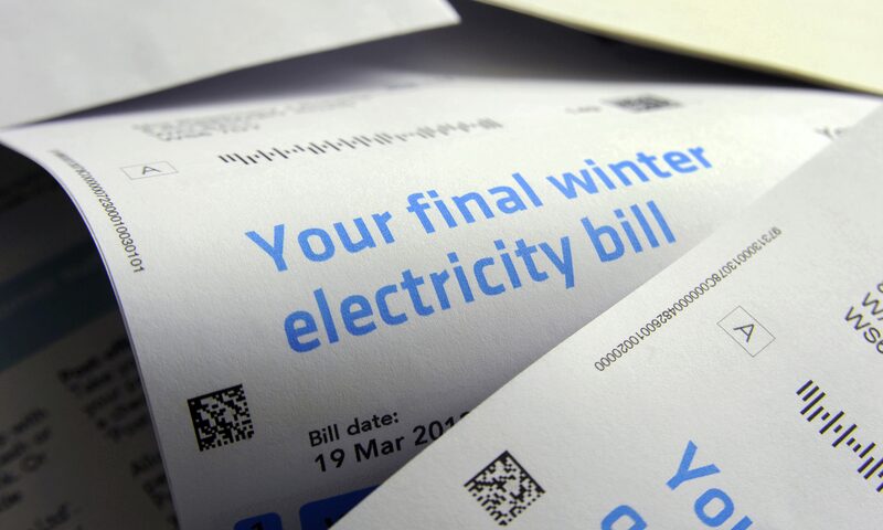 A close-up of printed paper electricity bills headed 'Your final winter electricity bill' with a bill date of 19 March