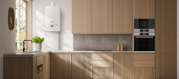 A white Baxi combi boiler mounted on the wall of a modern wood-fitted kitchen