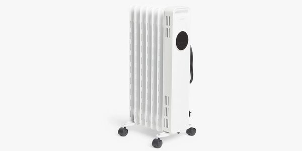 A white portable oil-filled electric radiator with fins, control panel and castor wheels on a plain background