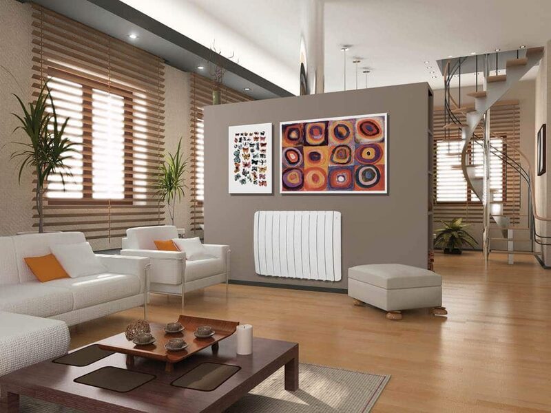 A white Haverland electric radiator mounted on a wall in a modern living room