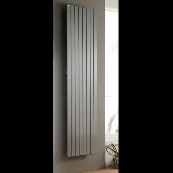 A tall vertical panel radiator mounted on a wall next to a window in a home