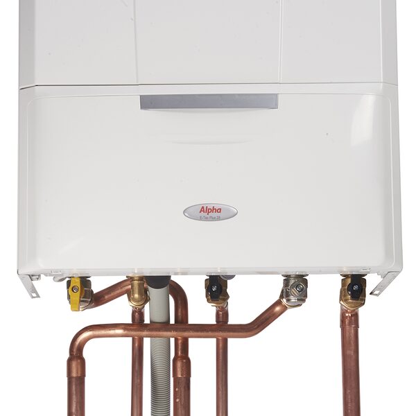 An Alpha E-Tec Plus wall-mounted gas boiler with copper pipe connections and valves beneath it