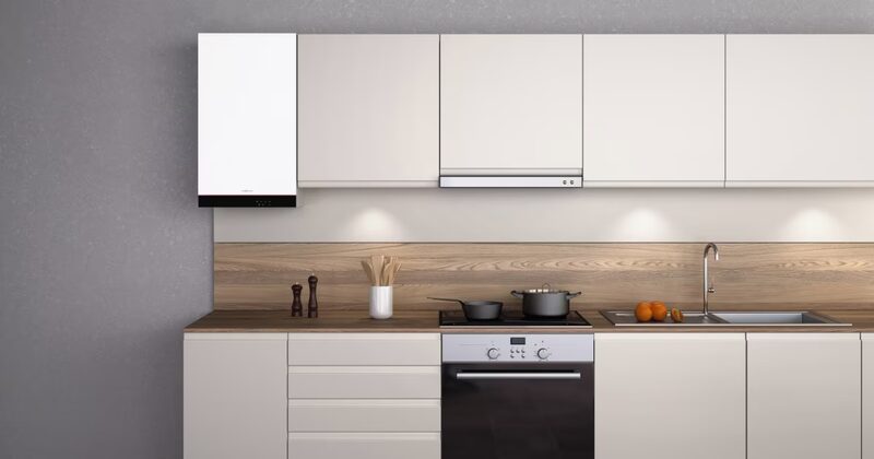 A white Viessmann Vitodens 050-W wall-mounted gas condensing boiler installed in a modern kitchen above the worktop