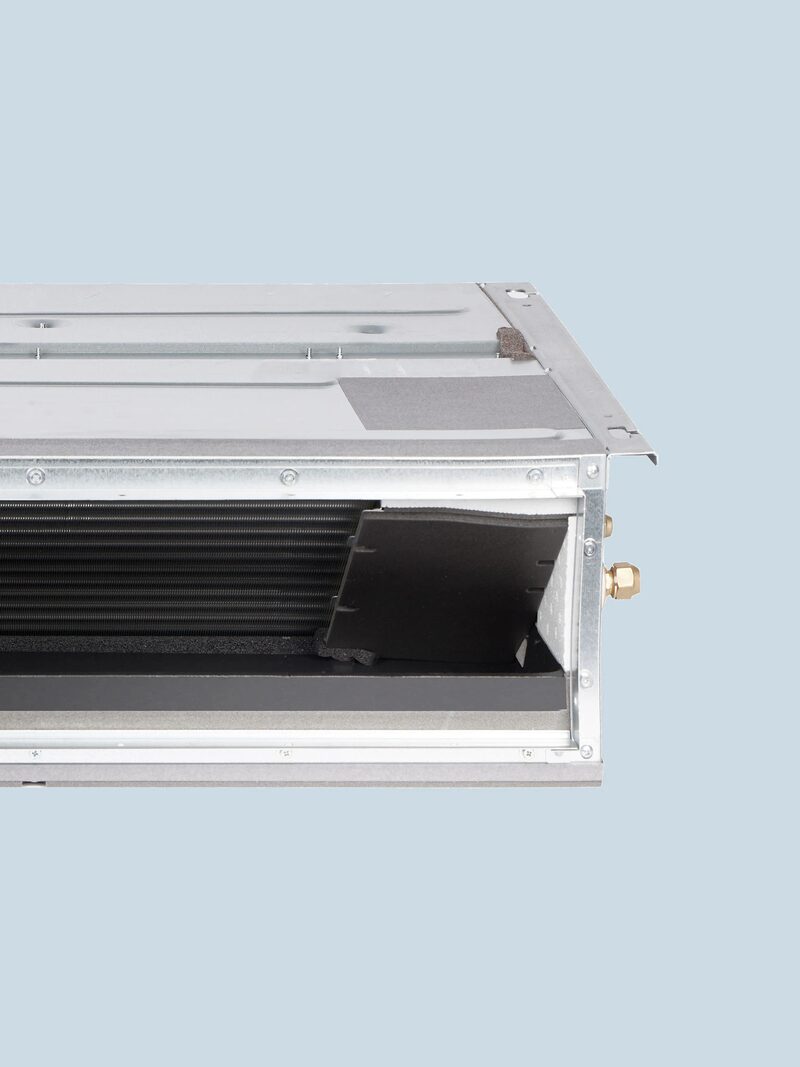 A close-up of a Daikin concealed ceiling ducted air conditioning unit showing its internal coil and pipework