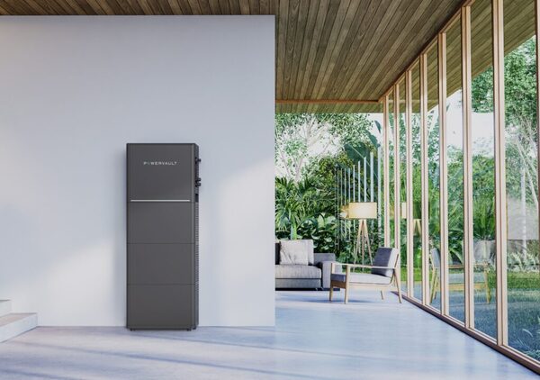 A Powervault P5 home battery storage unit standing against a wall in a modern open-plan living space