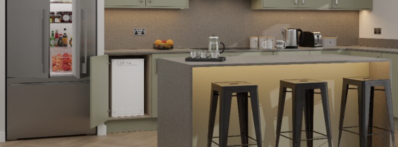 A Sunamp heat battery unit installed in a cupboard under the counter of a modern kitchen