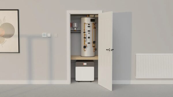 A rendered interior showing a hot water cylinder and heat pump unit installed in an airing cupboard beside a radiator