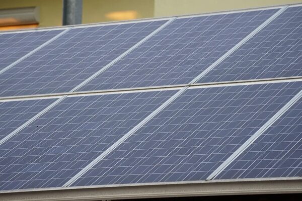 A close-up of several solar panels installed on a roof