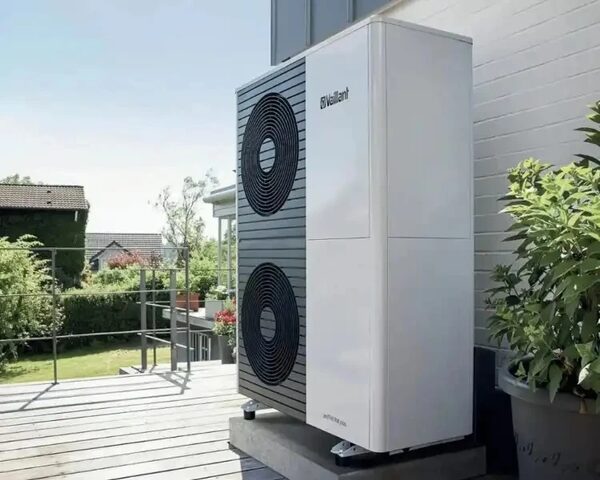 A Vaillant air source heat pump unit installed outside a house on a terrace
