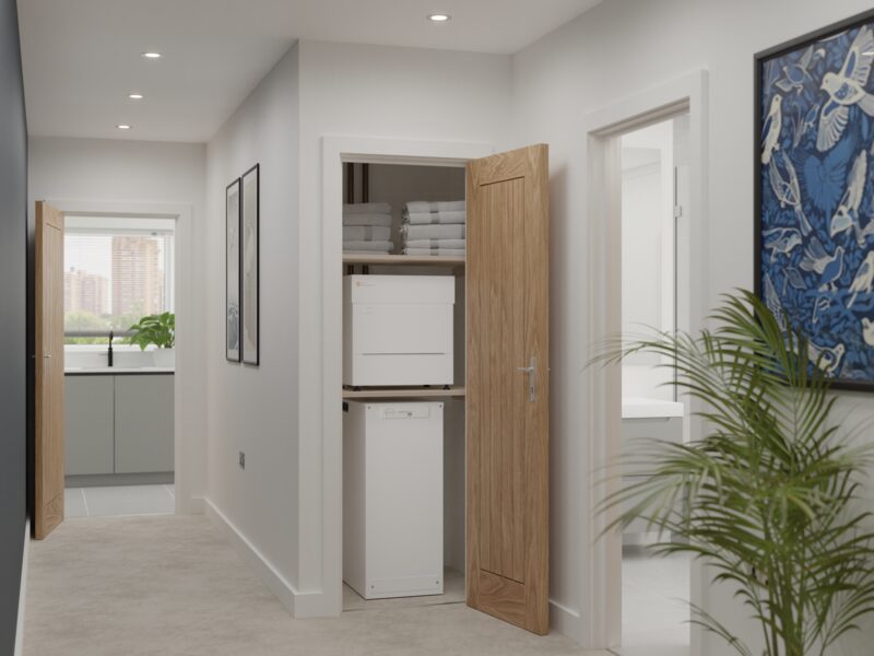 A Sunamp Thermino heat battery installed in an airing cupboard in a modern home hallway