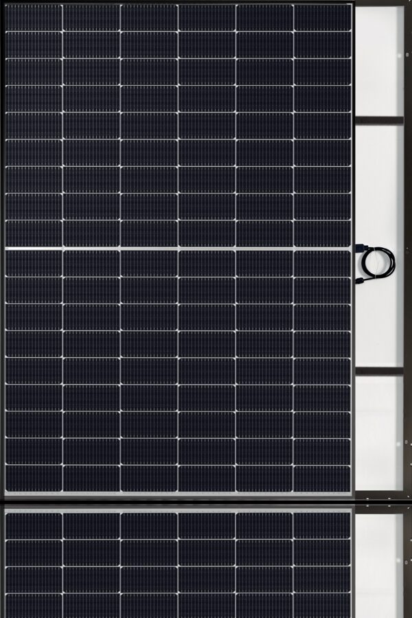 A full-face product photo of a black-framed monocrystalline solar PV panel with its rear junction box and cable visible on the right