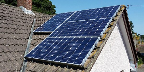 Solar panels installed on the tiled roof of a house