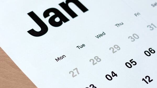 A close-up of a printed wall calendar showing the month of January