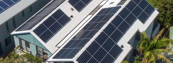 Aerial view of a house roof covered with solar panels