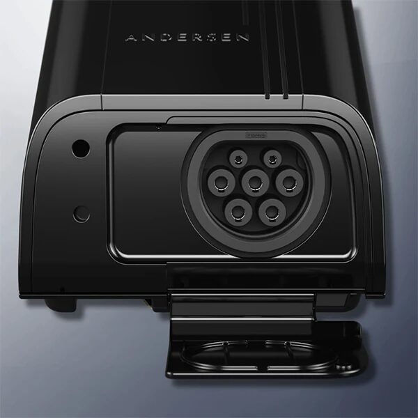 Close-up of a black Andersen EV wall charger with its Type 2 socket cover open