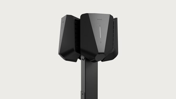 A black Easee EV charge point mounted on a pole, shown against a plain background