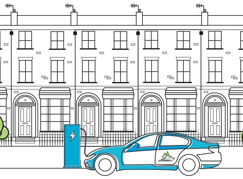 An illustration of an electric car charging at an on-street chargepoint outside a row of terraced houses