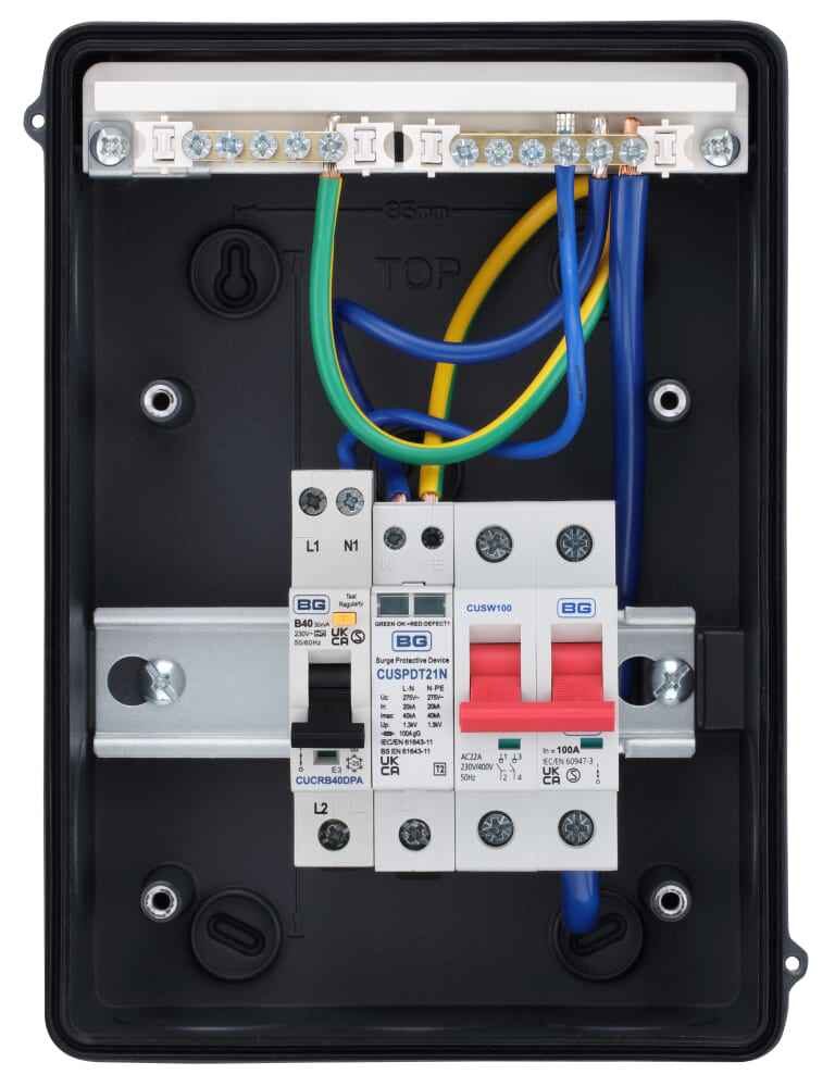 A BG consumer unit with 100A main switch, RCBO and surge protection device wired with cables, shown open