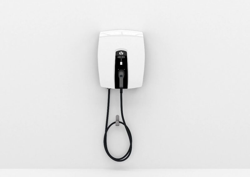 A white wall-mounted electric vehicle charge point with a coiled black charging cable on a plain white wall