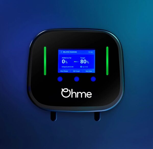 A black Ohme Home Pro wall-mounted EV charger with a blue screen showing delayed charging settings and green indicator lights