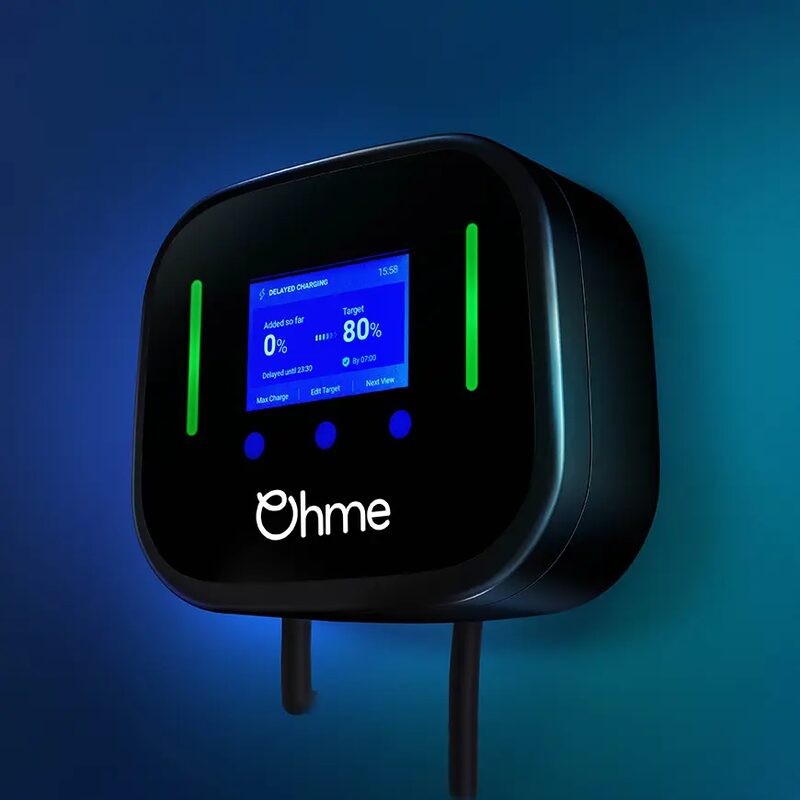 A black Ohme Home Pro wall-mounted EV charger with a colour display showing charging status and green indicator lights