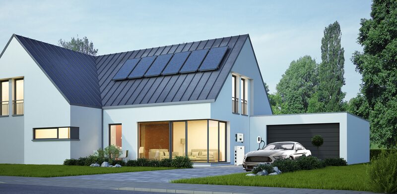 A modern house with rooftop solar panels, a wall-mounted home battery and EV charger by the garage, and an electric car parked outside