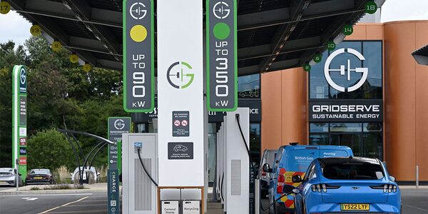 Electric cars charging at a Gridserve public EV charging forecourt with rapid chargers