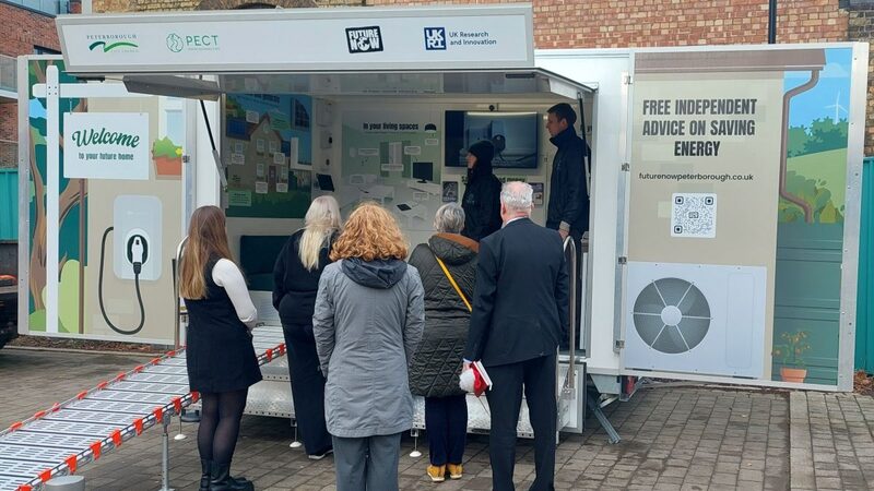 People visiting a Future Now Peterborough mobile energy advice trailer offering free independent advice on saving energy