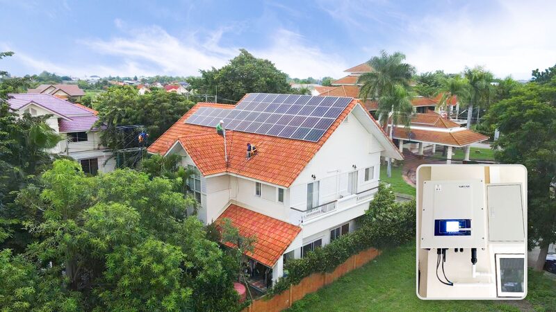 A house with rooftop solar panels and an inset photo of a Sofar solar inverter installed on a wall