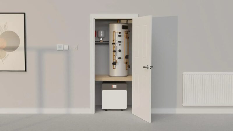 A heat pump cylinder and unit installed in an airing cupboard with a radiator on the wall of a home