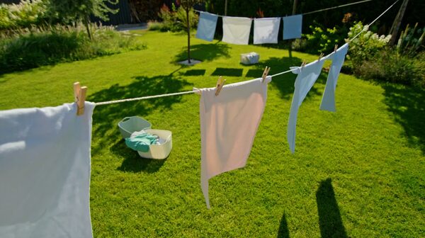 Laundry drying on a washing line in a sunny garden