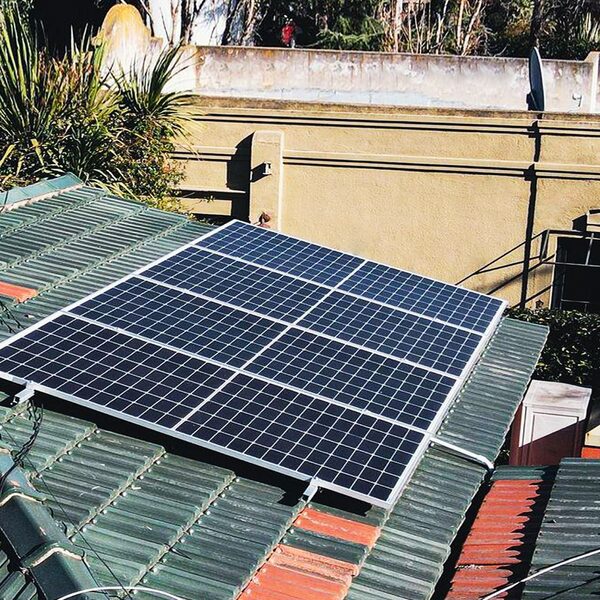 Solar panels mounted on a tiled residential roof