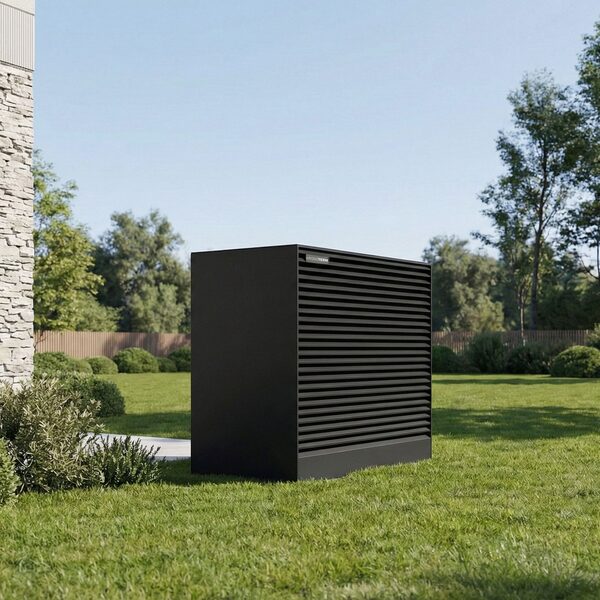 A black Kronoterm ADAPT 2 air source heat pump outdoor unit standing on a lawn beside a house