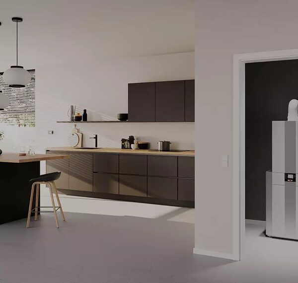 A modern kitchen with a gas boiler installed in an adjacent utility room