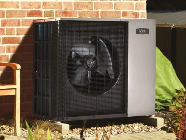 An Ideal air source heat pump monobloc unit installed outside a brick house