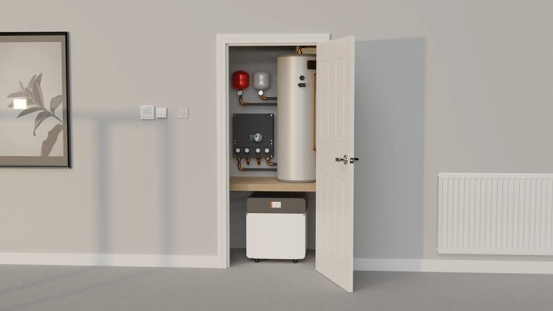A ground source heat pump unit and hot water cylinder installed inside a household airing cupboard with the door open