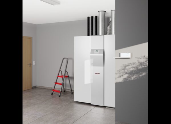 A Stiebel Eltron heat pump / heating unit installed in a utility room with a wall-mounted control unit beside it