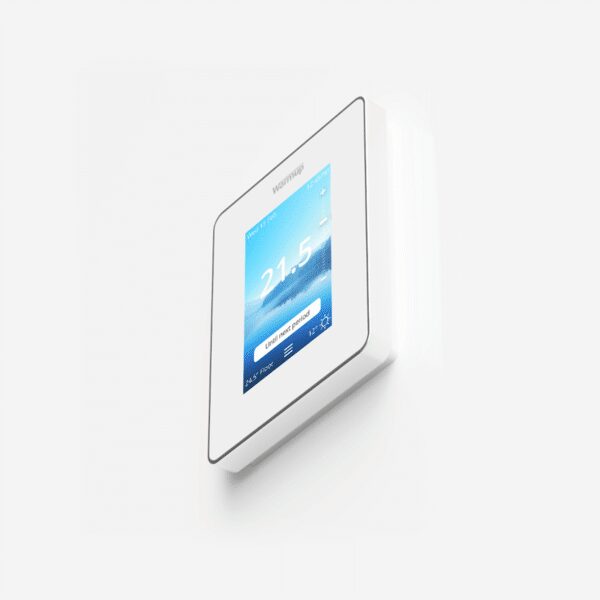 A white Warmup smart thermostat mounted on a wall displaying a temperature of 21.5 degrees