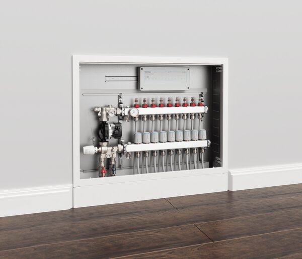 A Warmup underfloor heating manifold with control unit recessed into a white wall above wooden flooring