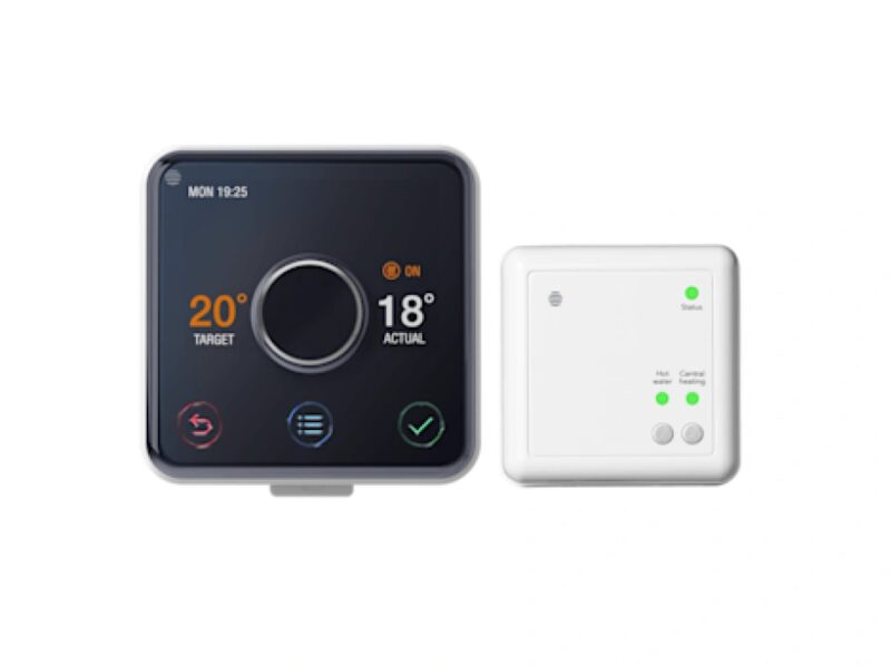 A Hive smart thermostat with target and actual temperatures next to its white receiver hub