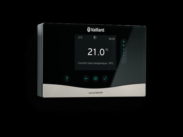 A Vaillant sensoCOMFORT wall-mounted heating control thermostat with a black touchscreen displaying the room temperature