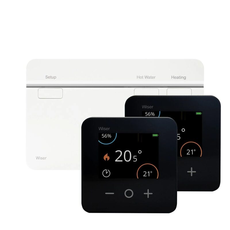 A Wiser smart thermostat kit with two black room thermostats showing temperatures and a white heating controller hub