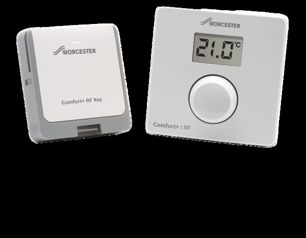 A Worcester Bosch Comfort+ I RF room thermostat with digital display next to its Comfort+ RF Key plug-in receiver module