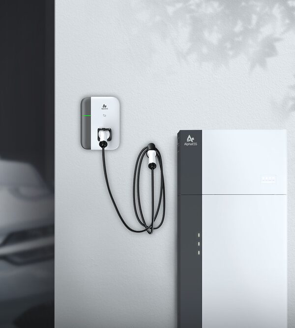 An AlphaESS wall-mounted home battery storage unit next to an AlphaESS EV charger with cable on a white wall