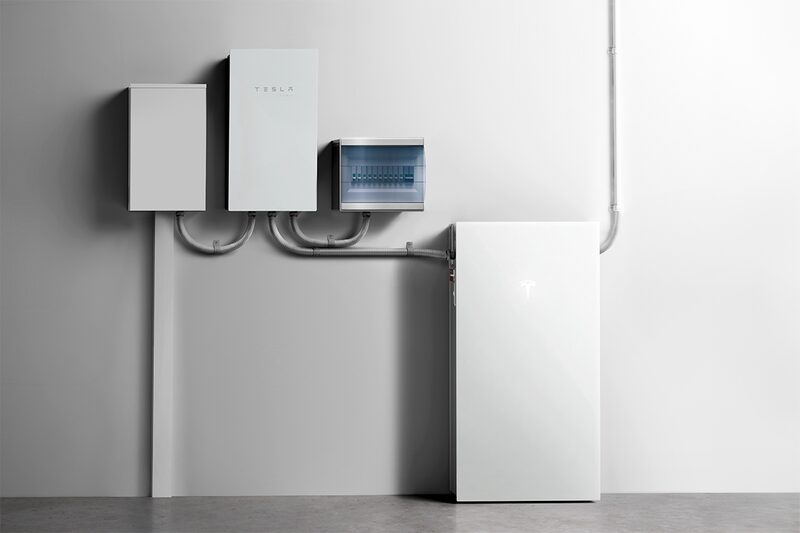 A Tesla Powerwall 3 home battery installed on a wall with backup gateway and electrical panels connected by conduit