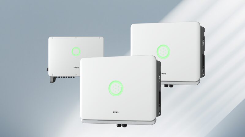 Three white SAJ H2 Series hybrid solar inverters shown against a grey studio background