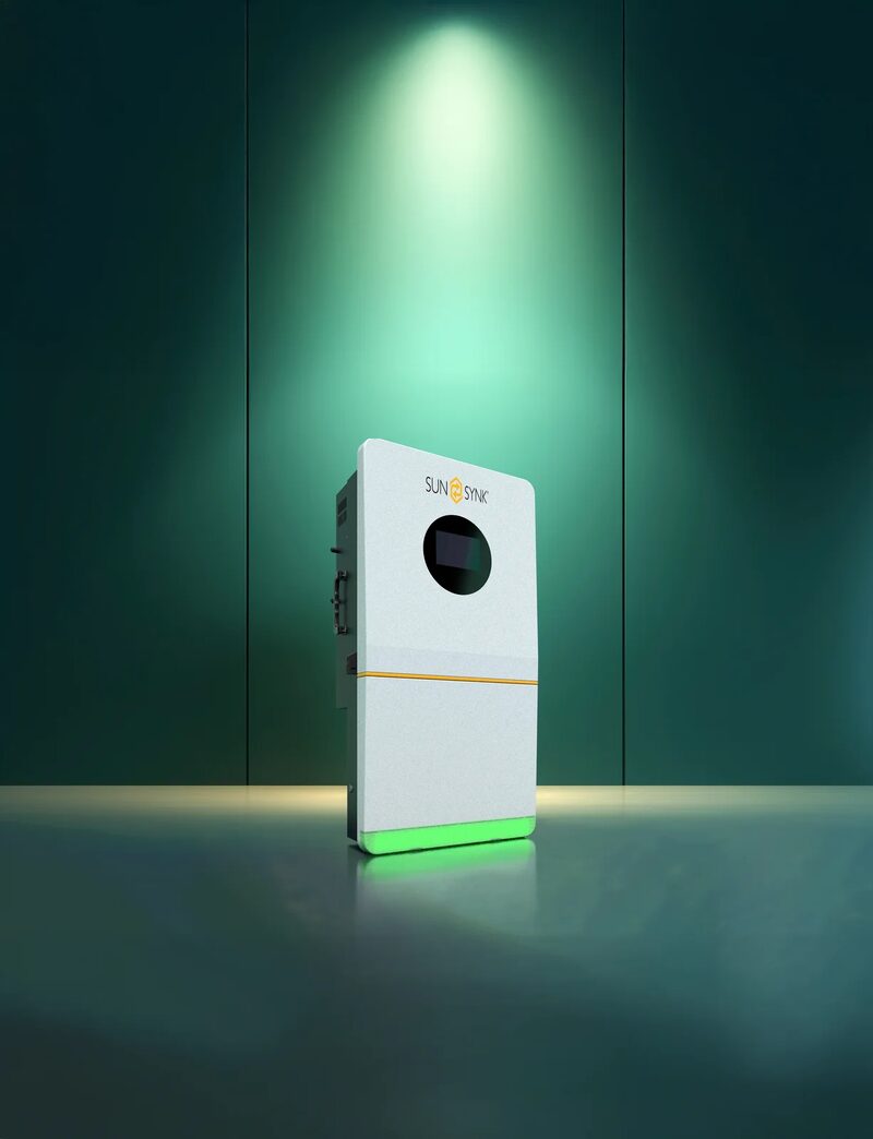 A white Sunsynk wall-mounted battery/inverter unit with a round display, shown against a green-lit studio background