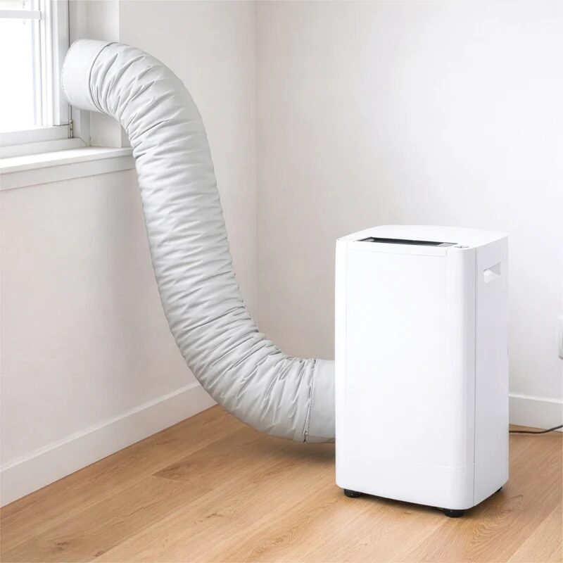 A white portable air conditioner with an insulated grey exhaust hose sleeve running from the unit to a window