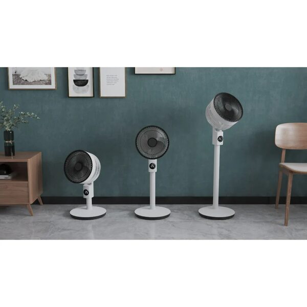 Three white Meaco pedestal and desk air circulator fans of different sizes standing in a styled living room